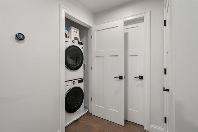 94 Webster Unit 94, Newton, MA 02465 - laundry room featuring stacked washer and clothes dryer and dark wood-style flooring