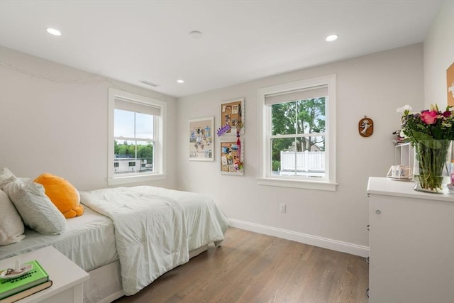 94 Webster Unit 94, Newton, MA 02465 - bedroom with light wood-type flooring, baseboards, and recessed lighting