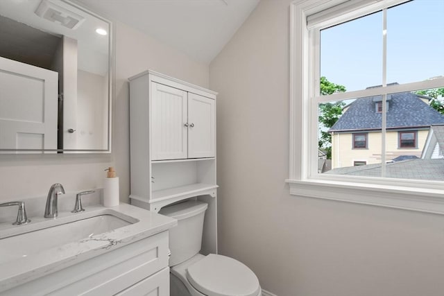 94 Webster Unit 94, Newton, MA 02465 - bathroom featuring vanity, toilet, and baseboards