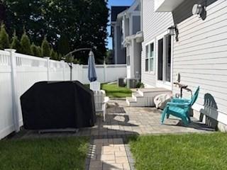94 Webster Unit 94, Newton, MA 02465 - fenced backyard with a patio area