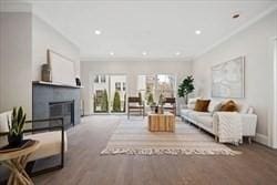 94 Webster Unit 94, Newton, MA 02465 - living area featuring a fireplace, recessed lighting, and ornamental molding