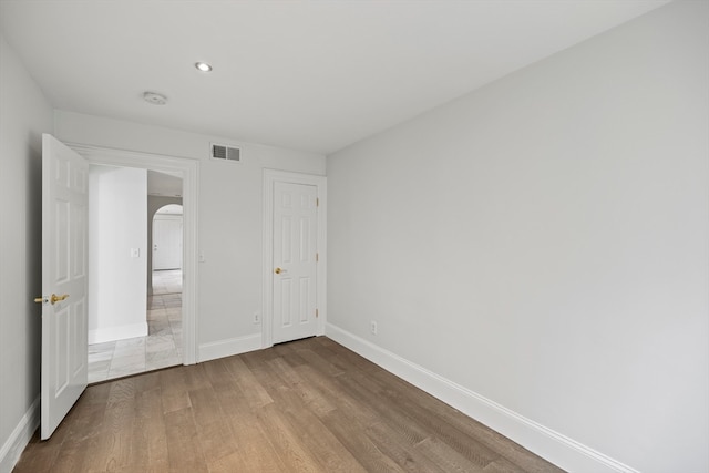 unfurnished bedroom featuring light wood-type flooring