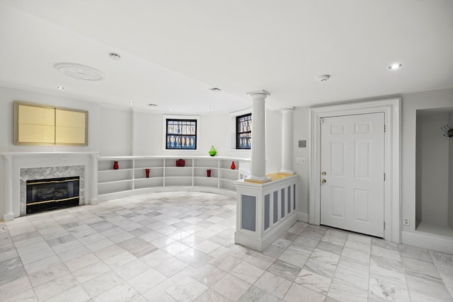 interior space featuring a fireplace and ornamental molding