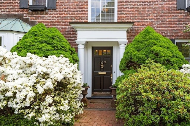entrance to property with brick siding