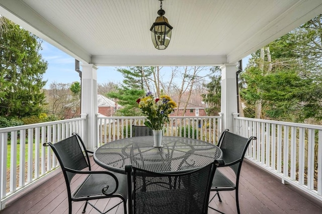 deck with outdoor dining area