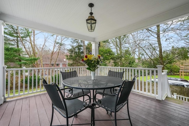 wooden deck with outdoor dining area