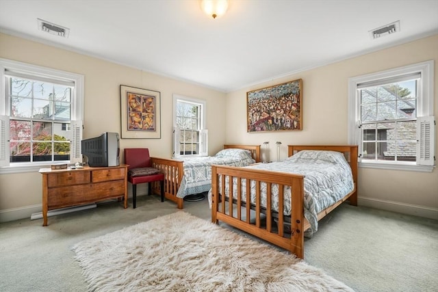 carpeted bedroom featuring baseboards
