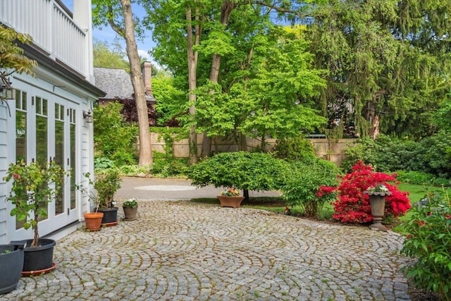 view of patio featuring french doors and fence
