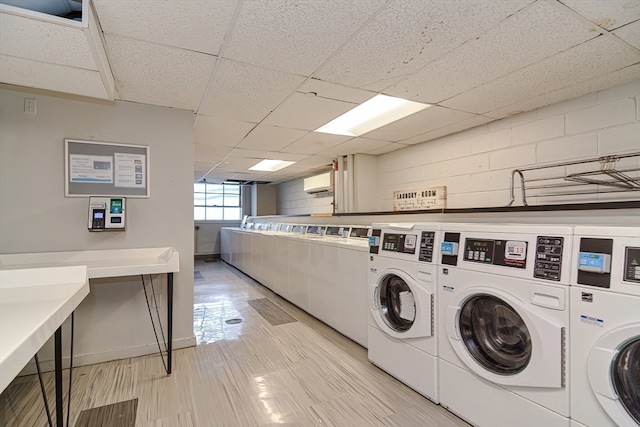 washroom with independent washer and dryer and an AC wall unit