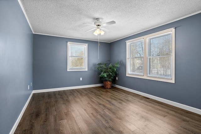 unfurnished room with ornamental molding, hardwood / wood-style floors, and ceiling fan