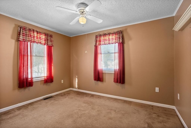 unfurnished room featuring crown molding, a textured ceiling, ceiling fan, and carpet flooring