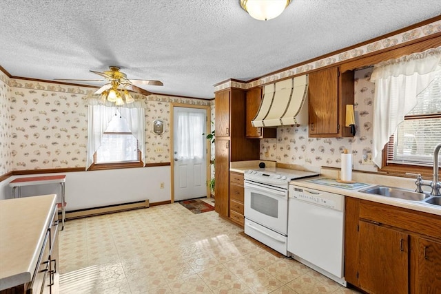 kitchen with dishwasher, sink, a baseboard heating unit, electric range, and wall chimney range hood