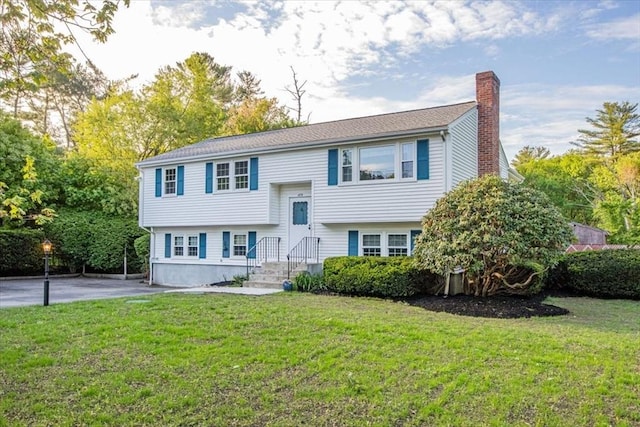 479 W, West Bridgewater, MA 02379 - bi-level home with a chimney and a front lawn