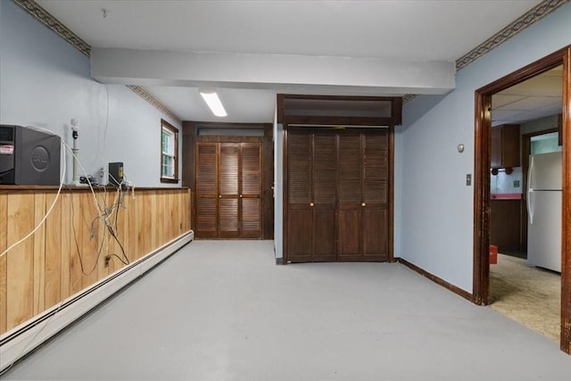 479 W, West Bridgewater, MA 02379 - basement featuring freestanding refrigerator, a baseboard radiator, carpet floors, and wooden walls