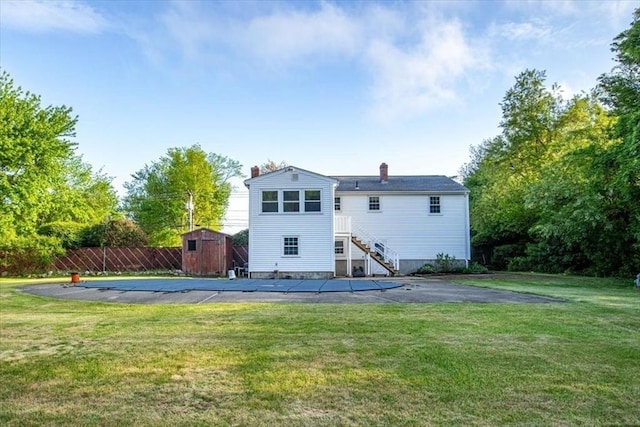 479 W, West Bridgewater, MA 02379 - rear view of property featuring a storage shed, an outdoor structure, a patio area, and a chimney