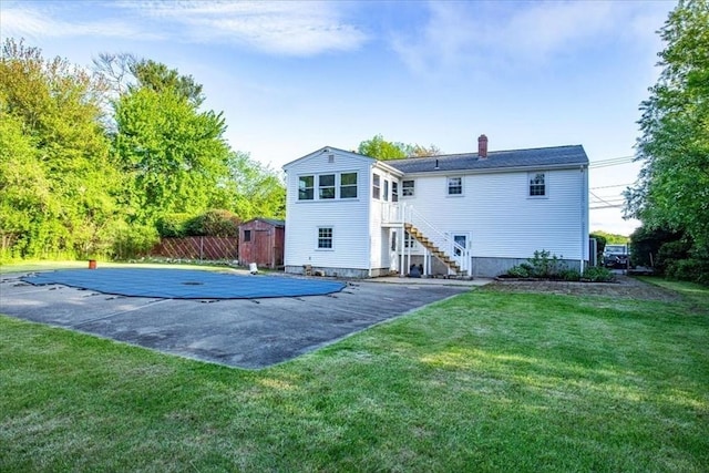 479 W, West Bridgewater, MA 02379 - back of house with a shed, a chimney, an outbuilding, stairs, and a lawn