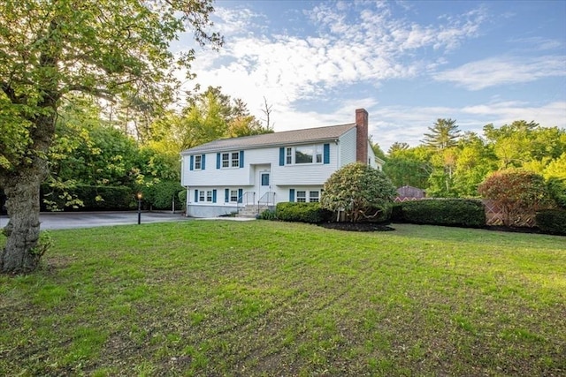 479 W, West Bridgewater, MA 02379 - view of front facade with a chimney and a front yard