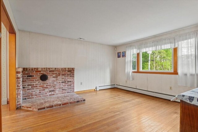 479 W, West Bridgewater, MA 02379 - unfurnished living room with hardwood / wood-style flooring and baseboard heating