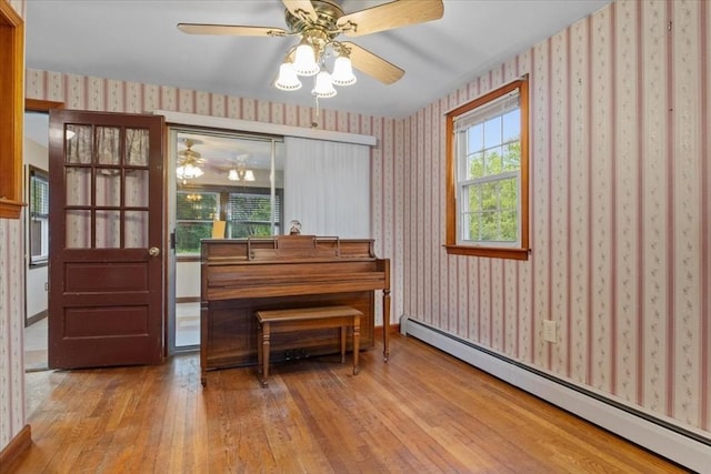 479 W, West Bridgewater, MA 02379 - sitting room with a baseboard heating unit, wallpapered walls, hardwood / wood-style floors, and ceiling fan