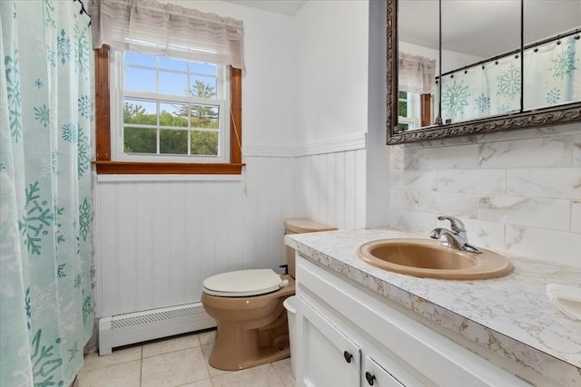 479 W, West Bridgewater, MA 02379 - full bath with a baseboard heating unit, tile patterned floors, toilet, a wainscoted wall, and vanity