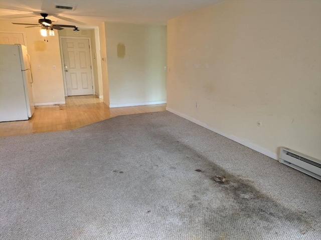42 Old Colony Way Unit 30, Orleans, MA 02653 - spare room featuring light colored carpet, ceiling fan, and a baseboard radiator