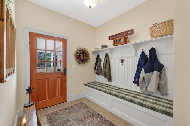 mudroom featuring light tile patterned floors and baseboards