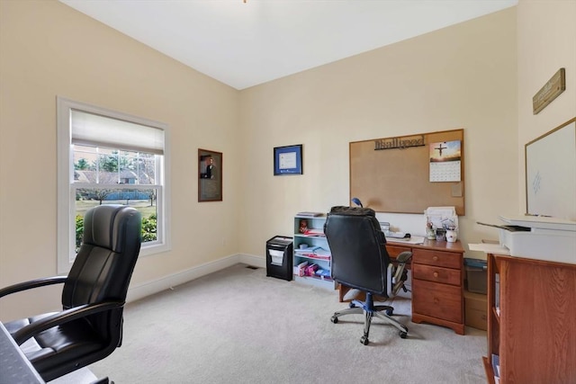 home office with light carpet and baseboards