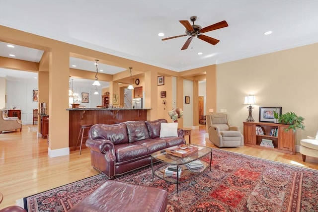 living area featuring recessed lighting, light wood finished floors, and ceiling fan
