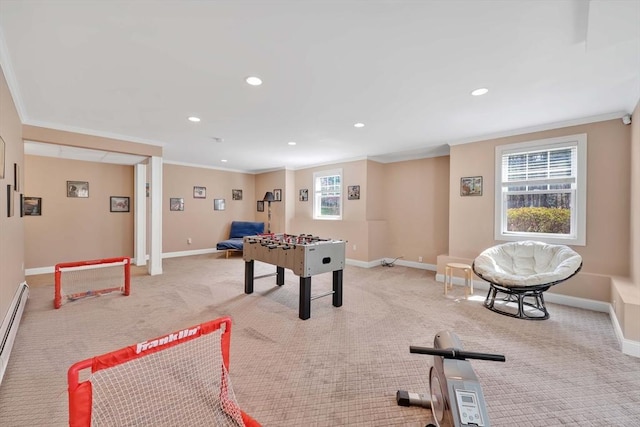 recreation room with ornamental molding, baseboards, recessed lighting, and light carpet