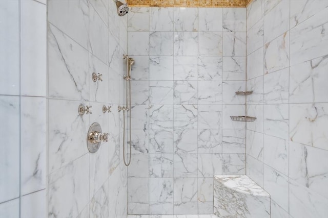 bathroom featuring a tile shower