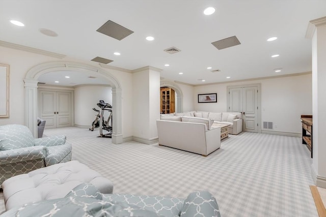 living room with ornate columns, ornamental molding, and light carpet