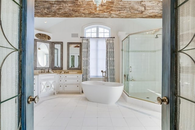 bathroom with independent shower and bath, vanity, and tile patterned flooring