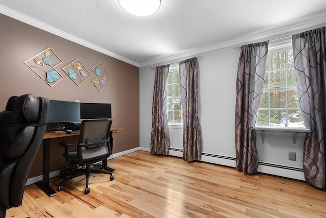 office area with a healthy amount of sunlight, a baseboard radiator, light wood-style flooring, and crown molding