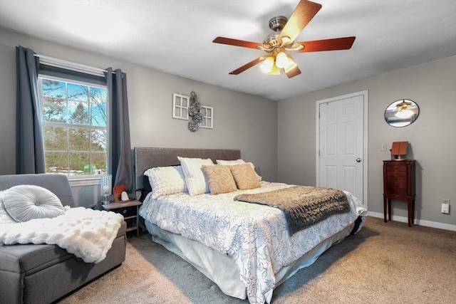 bedroom featuring carpet floors, baseboards, and a ceiling fan