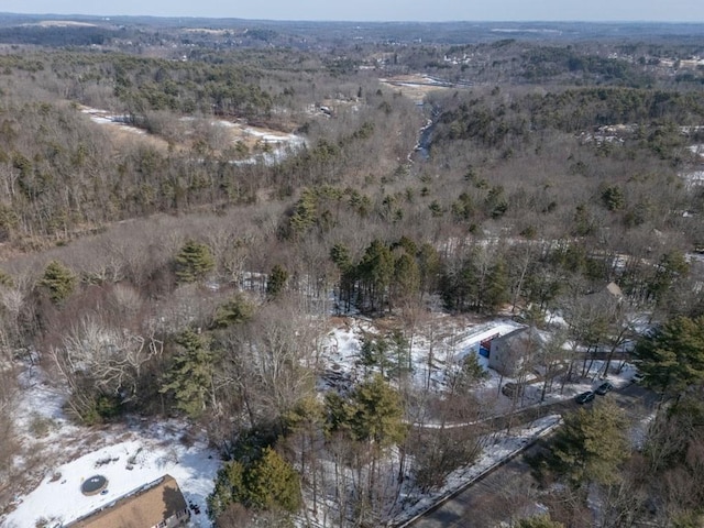 aerial view featuring a wooded view