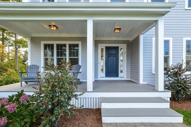 entrance to property featuring covered porch