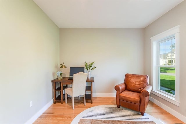 office area with plenty of natural light and light wood-type flooring