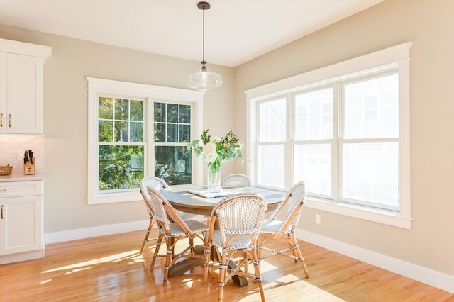 dining area with light hardwood / wood-style flooring