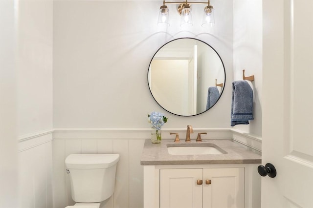 bathroom with toilet and vanity