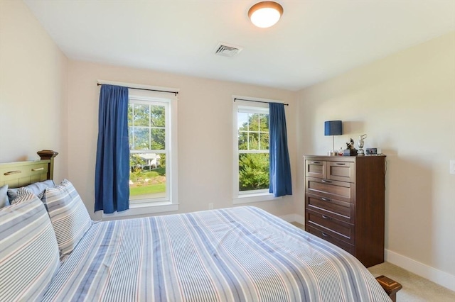 bedroom with light colored carpet