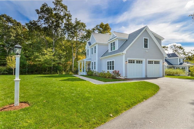 view of front of house featuring a garage and a front yard