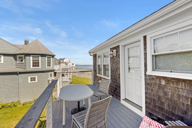 wooden deck featuring a water view