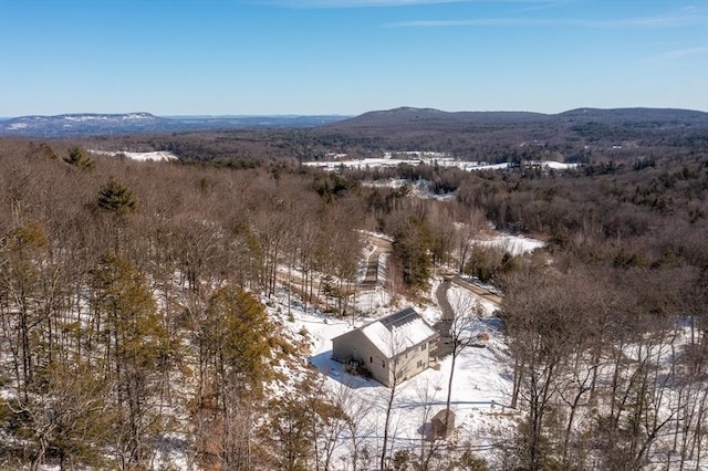 snowy aerial view featuring a mountain view