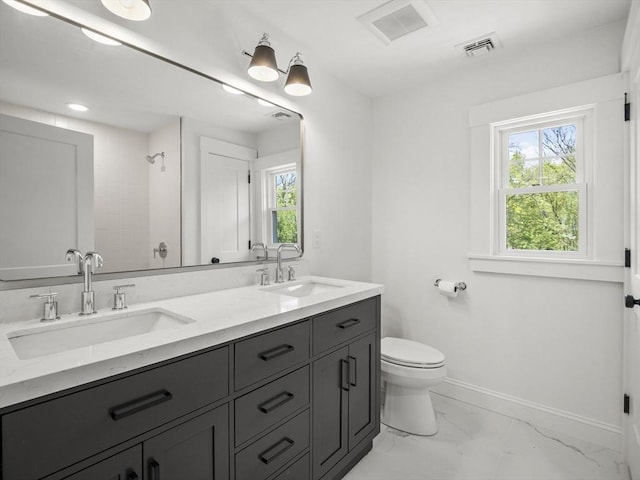 bathroom with visible vents, a sink, a shower, and toilet
