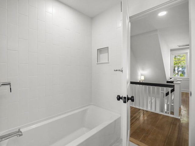 bathroom with recessed lighting, baseboards, shower / tub combination, and wood finished floors
