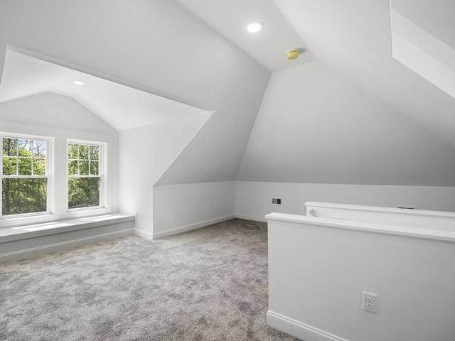 additional living space with baseboards, carpet, recessed lighting, and lofted ceiling