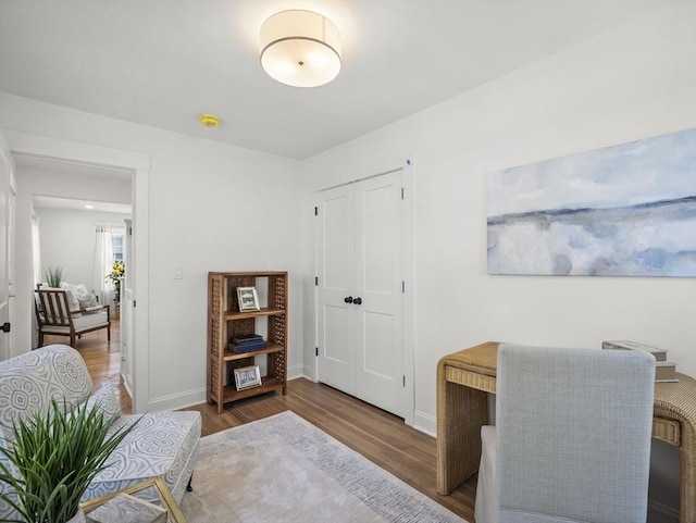 office featuring baseboards and wood finished floors