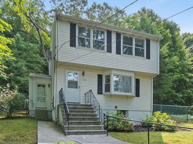 view of front of home with a front lawn