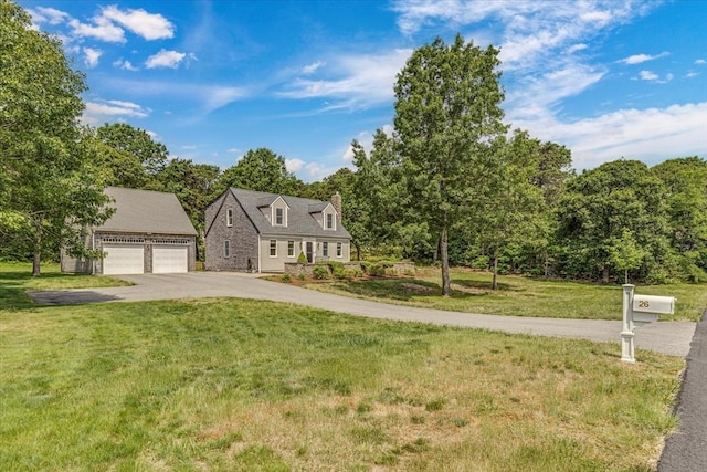 26 Sandy Meadow Way, Eastham, MA 02642 - new england style home featuring a chimney, a front lawn, an outbuilding, and a detached garage
