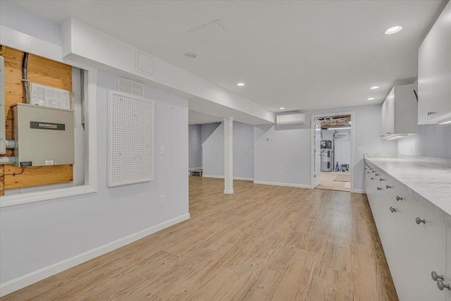 26 Sandy Meadow Way, Eastham, MA 02642 - unfurnished living room with light wood-style floors, recessed lighting, and an AC wall unit